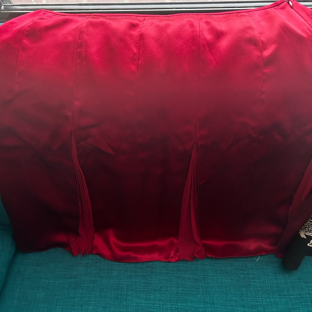 Red skirt with pleats.